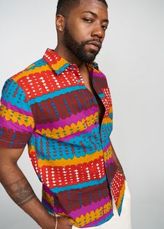 Style#: M2015​ Step out with confidence, in our Keyon Men's African Print Button-Up Shirt in Orange Teal Adire. This dynamic cotton, button-up, shirt is a statement piece for the contemporary man who embraces bold style. Description Orang Button-Up Shirt Short Sleeve Collared Neckline Pocket at Chest 100% Cotton Designed in the USA, imported *Print placement may vary* Care Instruction Hand Wash Cold. Mild Detergent. Do Not Bleach. Hang to Dry. Models Size: M | Height: 6'2 | Chest: 40 | Waist: 33 Multicolor Print Cotton Shirt For Beach, Beach Cotton Shirt With Vibrant Print, Multicolor Cotton Beach Shirt, Multicolor Print Cotton Beach Shirt, Casual Colorful Beach Shirt, Short Sleeve Cotton Shirt With Vibrant Print, Cotton Short Sleeve Shirt With Vibrant Print, Vibrant Print Short Sleeve Cotton Shirt, Multicolor Short Sleeve Shirt With Vibrant Print