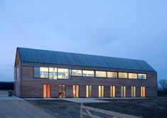 a large wooden building with lots of windows