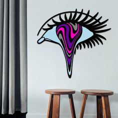 two stools in front of a wall with an abstract painting on it's side