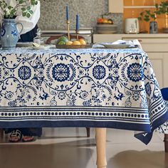 a blue and white table cloth on a kitchen counter