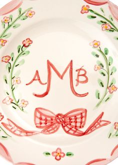 a personalized plate with a bow on it