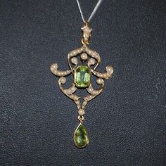 ad eBay - ANTIQUE Edwardian 9ct Gold Peridot and Seed Pearl Pendant - Buy Now, click the link (eBay) Elegant Multi-stone Peridot Gemstones, Fine Jewelry Peridot Gemstones For Formal Occasions, Art Nouveau Yellow Gold Jewelry With 17 Jewels, Art Nouveau Yellow Gold Jewelry For Formal Occasions, Yellow Gold Peridot Gemstone Jewelry, Elegant Formal Necklace With Peridot, Formal Yellow Gold Gemstone Pendant, Formal Peridot Pendant Necklace, Formal Yellow Gold Peridot Necklace