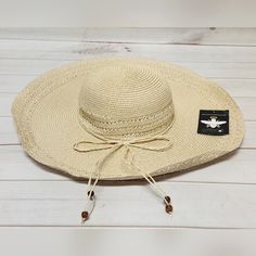 *New With Tags *Inner Band: Approx. 18.5" *Brim: Approx. 5.31"W *Crown: Approx. 4.72"H *Fit: Fitted: Slightly More Relaxed Than A Close Fit; Still Outlines Figure But Not Tightly *Content: 100% Paper *Fabrication: Woven Paper Straw *Embellishment/Trim: Braided Self-Fabric Tie Around Base Of Crown With Beaded Ends *Style: Floppy Sun Hat *Crown: Round *Brim: Wide, Flat Floppy *Interior: Grosgrain Fabric Headband *Stay Away From The Rays In This Oversized Straw Hat, Featuring A Wide, Floppy Brim Pe Sun And Beach, Floppy Sun Hat, Floppy Sun Hats, Fabric Headbands, Beach Hat, Paper Straws, Woven Paper, Sun Hat, Straw Hat