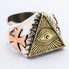 Old as the hills, the Eye of Providence, otherwise known as the All-Seeing Eye, is one of the most peculiar symbols out there. It is even stranger to see it in jewelry. Nevertheless, if incongruous jewelry is up your alley, don't miss your chance to flaunt this outlandish Eye of Providence Ring by our store.The all-seeing eye has many interpretations. In the Christian religion, it means god, and the rays of light emanating from him is his glory. However, this symbol is increasingly associated wi Adjustable Symbolic Metal Rings, Symbolic Open Ring In Metal, Symbolic Adjustable Ring With Unique Design, Symbolic Metal Promise Ring, Symbolic Rings With Unique Design For Gift, Handmade Symbolic Bronze Rings, Symbolic Handmade Metal Rings, Spiritual Engraved Metal Rings, Handmade Symbolic Promise Rings