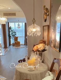 the dining room is decorated with chandeliers and flowers