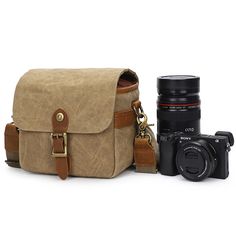 a camera and a bag sitting next to each other