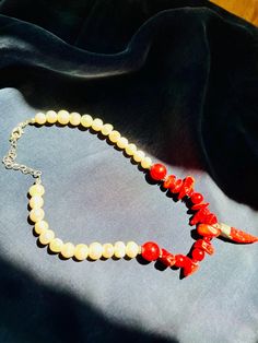 This unique necklace, in which we combined real pearls and corals, was carefully produced for you. The relaxing properties and visually unique nature of coral stone make this necklace more than just an accessory.   Known properties of coral stone; - Gives peace and calms down. - It opens the mind. - Strengthens communication. -It is effective in maintaining emotional balance. This healing and unique necklace is made of real pearls. Our limited edition necklace makes a great anniversary gift. Nec Elegant Red Coral Gemstone Necklace, Spiritual Red Coral Necklaces With Polished Beads, Elegant Beaded Red Coral Pearl Necklace, Spiritual Red Coral Necklace With Polished Beads, Elegant Red Coral Beaded Pearl Necklace, Elegant Orange Pearl Necklace Gift, Coral Necklace With Natural Red Coral Stones, Elegant Red Coral Necklace With Lobster Clasp, Red Coral Jewelry With Natural Stones In Round Beads