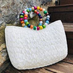 💥Introducing our Plastic Canvas Bag with a delightful twist of bohemian chic! 💥This Authentic Handmade beauty deserves a prime spot in your summer tote collection. 💥 Crafted with love using Crochet Raffia, this oversized handbag boasts a stylish Straw Bag design that perfectly complements the wooden beaded handle. 💥 It's the perfect accessory for your next beach getaway or vacation, and makes for an unforgettable Mothers Day gift or special surprise for that special someone.  💥Embrace the r Summer Rectangular Crochet Bag, Bohemian Beaded Beach Bag For Summer, Beach Tote Bag With Pearl Handle, Bohemian Beaded Bags For Vacation, White Beaded Bags For Summer, Bohemian Beaded Rectangular Beach Bag, Bohemian White Bag For Vacation, White Beaded Summer Bags, Summer White Beaded Bags