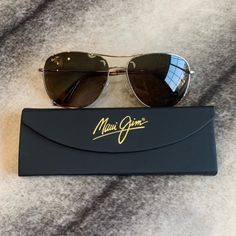 Maui Jim Cliff House Polarized Aviator Sunglasses Nwt Msrp $320 Unisex Brand New Never Worn With Folding Case And Cloth Frame: Gold Lens: Hcl Bronze - Versatile In Changing Conditions With A Warm Tint. Lens Material: Mauipure - Our Most Popular Lens Material. It Combines Optics Almost As Crisp As Superthin Glass With Ultra Light And Excellent Scratch & Shatter Resistance. Sku: Hs247-16 Accepting Offers Formal Brown Rimless Sunglasses, Brown Rimless Sunglasses For Formal Occasions, Formal Brown Aviator Sunglasses With Polarized Lenses, Formal Brown Aviator Sunglasses With Tinted Lenses, Formal Brown Aviator Sunglasses With Uv Protection, Maui Jim Sunglasses Mens, Cliff House, Pearl Sandals, Purple Sunglasses