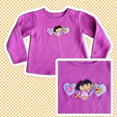 "Vintage Dora The Explorer Pink Embroidered Sweatshirt Sz Kids Small This is a vintage Dora The Explorer themed sweatshirt. The shirt is long sleeved and has an embroidered Dora with hearts on the center chest. The overall condition is good, there is some minor peeling. Colors: Pink Material : 100% Cotton Blend Quality Rating:  Tag Size: Kids Small  - Made in: Unknown - Brand: Nickelodeon Measurements shown in pictures are taken while garment is laid flat  14\" Pit to Pit - 16\" long from top collar to bottom hem 13\" from pit to edge of sleeve. Great preowned condition. No Holes, Stains or Bad Odors. See Pictures for Details." Dora The Explorer, Girls Graphic Tee, Embroidered Sweatshirt, Embroidered Sweatshirts, Pink Sweatshirt, Nickelodeon, Sweat Shirt, Graphic Sweatshirt, Girl Outfits