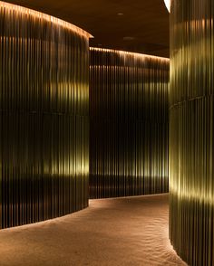 the interior of a building with green lights on it's walls and carpeted flooring