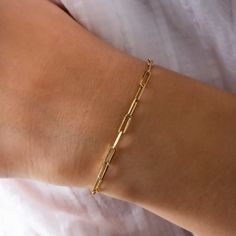 "14K Gold Paperclip Bracelet, Bold Link, Staple Chain, Rectangle Link, Elongated Link, Layering Chain, Mother's Day, 3mm, Birthday Gift its presence will make a difference on your wrist with its special design. It is suitable for daily use as well as for special occasions. More details; Our product is 2.20 gr in weight and 17 cm in length. Your products will be shipped with free shipping UPS express within 1-3 business days. All of our products has the stamp \"585\" on them. (which states that t Rectangular Paperclip Bracelet With Lobster Clasp, Classic Paperclip Bracelet With Rectangular Solid Links, Classic Paperclip Bracelet With Solid Link Construction, Rectangular Cable Chain Bracelet As Gift, Gold Link Bracelet With Paperclip Chain Gift, Gold Paperclip Chain Link Bracelet As Gift, Oval Link Paperclip Bracelet As Gift, Gold Paperclip Chain Link Bracelet Gift, Gift Cable Chain Bracelet With Rectangular Links