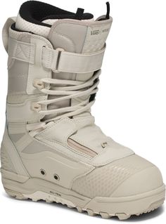 the snowboard boots are white and have laces on them