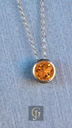 Unlock a world of vibrant beauty with the Citrine Solitaire Pendant 14k Gold - the perfect blend of elegance and simplicity. This minimalist, bezel-set orange gemstone necklace is the ultimate November birthstone pendant, making it the ideal gift for the special women in your life. Dainty Round Citrine Jewelry, Dainty Citrine Round Jewelry, Dainty Citrine Jewelry, Fine Jewelry Citrine Bezel Setting, 14k Gold Round Amber Jewelry, Round 14k Gold Amber Jewelry, 14k Gold Amber Round Jewelry, Yellow Gold Sterling Silver Birthstone Necklace With Round Stone, Everyday Round Citrine Jewelry