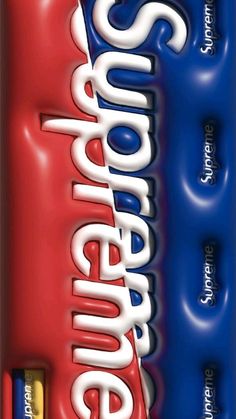 a close up of an energy bar with blue and red stripes on the front, and white letters on the back