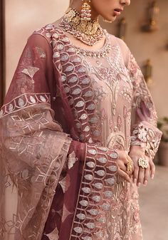 Embroidered Kameez with Wedding Lehenga and Dupatta is an elegant masterpiece that will give you a head-turning look on the big day. Sequins, motifs, beaming details, and classic contrast of peach color make this embroidered kameez a perfect choice for the wedding. The lavish details of Gota and embroidery make this beautiful lehenga Dress an epitome of beauty and your foremost priority. Embroidered Kameez: The beautiful kameez comes in a lavish tea-pink shade. The shimmering ornaments and embro Organza Cutwork, Pakistani Kameez, Pakistani Winter Dresses, Heavy Lehenga, Beautiful Lehenga, Lehenga Dress, Chiffon Sleeves, Pakistani Wedding Dress, Fancy Kurti