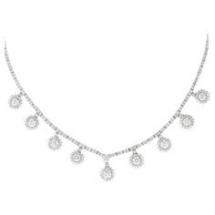 Exquisite dangling round brilliant diamond necklace. High jewelry by Alexander Beverly Hills. 12.76 carats total diamond weight. 9 round brilliant diamonds 4.56ct. 344 round diamonds, 8.20 carats. Approximately G/H color and SI clarity. Prong set in 18k white gold, 16in. Accommodated with an up-to-date digital appraisal by a GIA G.G. once purchased, upon request. Please contact us with any questions. Thank you. Item Number N6169 Diamond High Jewelry, High Jewelry Necklace, Modern Diamond Jewelry, White Diamond Jewelry, Diamond Tennis Necklace, Modern Necklaces, Handcrafted Necklace, Solitaire Pendant, Women Diamond