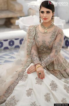 Pakistani Bridal Walima Outfit in Off White Color – Nameera by Farooq Semi-stitched Maxi Lehenga With Intricate Embroidery, Embellished Lehenga For Eid, Maxi Length, Embroidered Maxi Length Dupatta For Wedding, Embroidered Maxi-length Dupatta For Wedding, Bollywood Style Maxi Length Sharara With Intricate Embroidery, Anarkali Sherwani With Mirror Work For Reception, White Lehenga With Dabka Work For Wedding, Wedding Anarkali Choli Maxi Length, White Lehenga For Wedding With Dabka Work