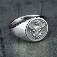 Taurus - The Bull: Independent and self-confident, you are naturally decisive and very determined. You are reliable, charming, balanced, and sometimes stubborn. Your observation skills and problem-solving abilities make you a great judge of character. 13mm round signet ring 10K White Gold with matching center Available in 2 fits: Luxe and Basic Available in 2 finishes: Satin and Polish Mens Rings Fashion, The Bull, Ring Shapes, Round Rings, Swirl Pattern, Oval Pendant, Pinky Ring, Men's Rings, Signet Ring