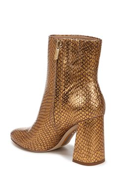 An almond toe and wrapped block heel balance a versatile bootie fashioned with a side zipper for easy entry. 3 1/4" heel 5" shaft Side zip closure Leather upper/synthetic lining/rubber sole Imported Gold Ankle Boots For Fall, Gold Ankle-high Boots With Reinforced Heel, Gold Heeled Boots With Reinforced Heel For Fall, Sam Edelman, Bootie, Side Zipper, Side Zip, Block Heels, Rubber Sole