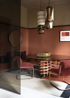 a dining room with a table and chairs