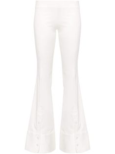 white cotton blend low-rise raised seam detail buttoned ankles flared hem concealed side hook and zip fastening Fitted Flare Pants With Button Closure, Chic Cotton Flares With Flared Hem, White Flared Wide Leg Cotton Pants, White Flare Wide Leg Cotton Pants, Chic Cotton Pants With Flared Hem, White Fitted Bottoms With Flared Hem, High Waist White Flares For Spring, White Chic Wide Leg Flares, Chic Fitted White Flares