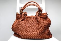 Made in Italy Handmade woven leather bag high quality natural Florence Leather, the leather woven is handmade. Size: 32 cm Height x 37 cm width x 18.5 cm depth Free shipment We made the bag in many colors, the bag is perfect for summer and winter, the leather is resistant and becomes even more beautiful over time. For any information about this bag don't hesitate to contact us Luxury Bohemian Top Handle Shoulder Bag, Luxury Cognac Shoulder Bag With Braided Handles, Luxury Tan Textured Leather Bags, Luxury Tan Textured Leather Shoulder Bag, Luxury Bags With Leather Handles In Natural Fiber, Luxury Natural Shoulder Bag With Leather Handles, Luxury High-end Textured Leather Shoulder Bag, Luxury Artisan Shoulder Bag With Braided Handles, Luxury Classic Satchel With Braided Handles