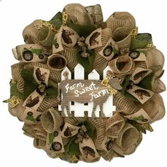 a wreath made out of burlocks and ribbon with a sign that says, forget to