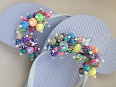 two pairs of flip flops with beads on them