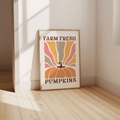 a farm fresh pumpkins poster is on the floor in front of a white wall