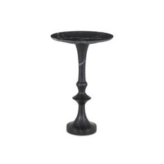 a black marble pedestal with an iron base