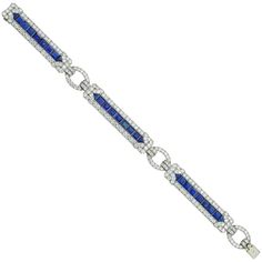 An Important Art Deco sapphire and diamond bracelet by Yard, consisting of three rectangular-shape flexible panels, each with a central row of calibre-cut sapphires surrounded by a diamond-set border of geometric design, connected by three oval-shaped diamond-set links, the sapphires estimated to weigh 10 carats in total, the old brilliant-cut diamonds estimated to weigh 11 carats in total, all mounted in platinum, signed Yard, circa 1930, measuring approximately 19 x 1.2cm, gross weight 34 grams. An Art Deco sapphire and diamond platinum bracelet in very good condition. Unmarked, bracelet tested as platinum and 18ct gold clasp tongue. This splendid Art Deco bracelet comes from the collection of Bentley & Skinner, the London jewellers by appointment to both Her Majesty the Queen and His Ro Bracelets Tennis, Bracelet Art, Bvlgari Jewelry, Platinum Bracelet, Bracelet Tennis, Vintage Tennis, Art Deco Bracelet, Art Deco Diamond Rings, Estilo Art Deco