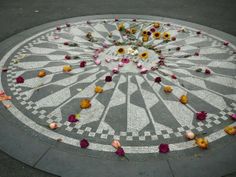 flowers are arranged in the middle of a mosaic