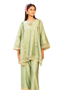 Light green kurta with tasseled detailing. Comes with pant and an inner. - Aza Fashions Elegant Sets With Tassels For Diwali, Festive Green Kurta With Tassels, Festive Green Tassel Kurta, Festive Green Tasseled Dupatta, Festive Kurta With Back Tassel Tie-up For Diwali, Elegant Festive Sets With Back Tassel Tie-up, Traditional Sets With Back Tassel Tie-up For Eid, Festive Sets With Tassels And Straight Kurta, Traditional Eid Sets With Back Tassel Tie-up