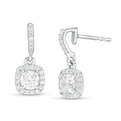 She'll appreciate the contemporary appeal of these smart diamond drop earrings. Fashioned in 14K white gold, each clever drop features a 1/4 ct. diamond sparkling a cushion-shaped frame of diamonds. The diamond-lined hook-shaped post adds further shimmer to the design. Radiant with 3/4 ct. t.w. of diamonds and a brilliant buffed luster, these earrings secure comfortably with friction backs. Classic Dangle Diamond Earrings With Halo Design, Classic Dangle Halo Diamond Earrings, Modern Halo Design Diamond Earrings For Formal Occasions, Modern Halo Diamond Earrings For Formal Occasions, White Cushion Cut Diamond Earrings For Formal Occasions, Fine Jewelry White Gold Cushion Cut Diamond Earrings, Formal Diamond Earrings With Cushion Cut And Diamond Accents, Formal Cushion Cut Diamond Earrings With Diamond Accents, Cushion Cut Sterling Silver Diamond Earrings For Formal Occasions