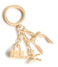 From Vera Bradley&#x2C; this Icons Bag Charm featuresCelebrate the icons of classic style with our Icons Bag Charm&#x2C; featuring a miniature duffel bag&#x2C; an adorable teddy bear&#x2C; and a delicate bow. Each charm is crafted with meticulous attention to detail&#x2C; combining playful whimsy with timeless elegance. Whether you're adding a touch of personality to your handbag or gifting it to someone special&#x2C; this charm captures the essence o Purse Accessories Ideas, Wishlist 2024, Gold Bag, Bag Charms, Handbag Charms, Christmas 2024, Shoe Charms, Christmas Wishlist, Christmas Wishes