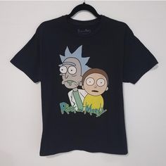 Rick And Morty T-Shirt Rick And Morty Men's Size L Adult Swim Black Large Graphic Print T-Shirt In Perfect Condition Measurements Pit To Pit: 21" Length: 30" Condition: 10/10 Size L Machine Washed 100% Cotton #Cartoon #Adultswim #Rickandmorty #Cartoontees #Depop Black Band Merch Tops With Cartoon Print, Black Band Merch Top With Cartoon Print, Black Cartoon Print Band Merch Top, Casual Black Shirt For Fan Merchandise, Black Top With Cartoon Print And Relaxed Fit, Black Tops With Cartoon Print In Relaxed Fit, Relaxed Fit Black Top With Cartoon Print, Black Relaxed Fit Top With Cartoon Print, Black Tops With Cartoon Print For Fans