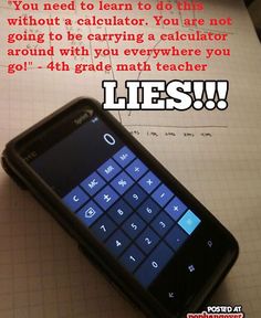 a cell phone sitting on top of a piece of paper next to a calculator