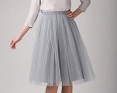 This Tulle Skirt is the ideal Bridesmaid Dress or Wedding Skirt and can be made in ANY color, ANY length, and ANY size. This Custom Skirt is lined with a soft satin fabric of the same or contrasting color as the tulle. ALL ITEMS HANDMADE BY ME IN USA The satin waistband is flat with zipper and hook/eye closure in back. Elastic can be added to the back of the waistband, however only allows for a little wiggle room. Dress it down with a denim shirt or formal with a lace top. A MUST HAVE IN YOUR CL Spring Wedding Pleated Skirt Bottoms, Knee-length Wedding Skirt, Elegant Fitted Spring Petticoat, Elegant Fitted Petticoat For Spring, Elegant Spring Fitted Petticoat, Spring Wedding Flowy Pleated Skirt, Elegant Stretch Pleated Petticoat, Fitted Skirt For Spring Bridesmaid, Elegant Stretch Lined Petticoat