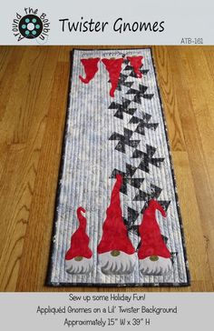 a quilted table runner with two dogs on it and the words twister gnomes