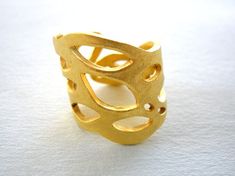 One of a kind handmade Gold Plated Organic Brass Ring made with the ancient lost wax method. No two rings will be exactly the same as they are completely handmade one by one. I made the Gold Plated Organic Brass Ring in wax and then had it casted in bronze and then yellow gold plated to avoid getting oxidised. This listing is for the Gold Plated Organic Brass Ring you can see in the picture it is yellow gold plated bronze. B A C K to my shop >> www.etsy.com/shop/StoixeioJewelry Made this w Matte Gold Brass Rings For Gift, Matte Gold Brass Rings As Gifts, Matte Gold Open Ring For Gift, Matte Gold Open Ring Perfect As A Gift, Unique Gold Open Band Ring, Hand Cast Wide Band Ring Gift, Brass Open Ring With Unique Design, Handmade Gold Open Ring Jewelry, Adjustable Gold Wide Band Ring With Open Shape