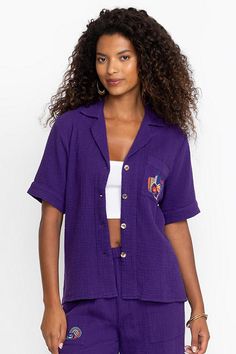 Crafted from 100% breathable cotton, the Desire Camp Shirt is embellished with intricate colorful embroidery at the front and back. Featuring a classic collared button-front, this relaxed-fit casual shirt is finished with a patch pocket at the chest. Pair with linen shorts and strappy sandals for a vibrant weekend look. Johnny Was Women's Camp Shirt in Violet Indigo Purple, Size Small, Linen/Cotton Indigo Purple, Colorful Embroidery, Women Camping, Boho Chic Outfits, Women's Blouses, Camp Shirt, Chic Outfit, Embroidered Jeans, Linen Shorts