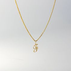 A timeless piece that will never go out of style. This 14K gold calligraphy pendant is the perfect and most stunning way of keeping a name close to your heart. We handmade each piece so you can assure you're getting a one-of-a-kind pendant that is not like any other. This 14K solid gold letter pendant is flawlessly crafted to look super chic and elegant around your neck. Pair it with a nice gold chain and wear it with almost all of your outfits. The piece is such a versatile lettering necklace. F Necklace, G Necklace, F Initial, G Initial, Gold Letter Pendants, Initial F, Initial G, Crystals Necklace, Pretty Jewelry Necklaces