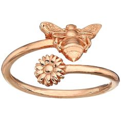 a gold ring with a bee and flower on it