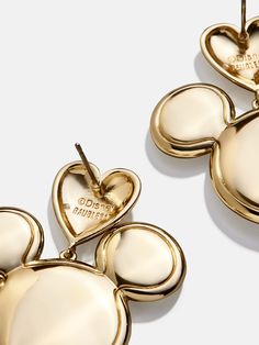 Show off your Disney love with the Mickey Mouse Disney Gold Heart Earrings. These earrings feature Mickey with love literally sitting on his head. Fully colored in gold, this statement piece pairs well with any ‘fit. This is an officially licensed Disney product. Gold Heart Earrings, Disney Gold, Gold Heart Earring, Mickey And Friends, Disney Love, Gold Heart, Heart Of Gold, Heart Earrings, Disney Mickey