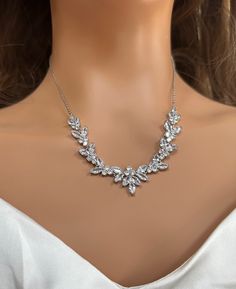 "Very romantic diamond bridal necklace set: necklace, bracelet and earrings.  Gorgeous bridal or bridesmaids jewelry set for a wedding day!   This wedding jewelry set is available in silver, gold or pink gold(rose gold) color to match your dress.   Necklace measures about 16\" long and 18\" with an extension attached. Earrings are about 2\" long and 1/4\" wide. Matching regular bracelet is measuring: 7\" long and 1/4\" wide or an adjustable bolo matching bracelet is available as well. High quali Dazzling White Gold Jewelry Sets For Wedding, Elegant Silver Bridal Sets For Wedding, Wedding Rhinestone Necklace With Diamond Accents, Delicate Silver Jewelry Sets For Formal Occasions, Wedding Jewelry Sets In White Gold With Diamond Accents, White Gold Jewelry Sets With Sparkling Stones For Wedding, White Gold Cubic Zirconia Jewelry For Wedding, White Gold Cubic Zirconia Wedding Jewelry, Elegant Crystal Bridal Sets For Bride