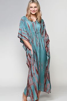 "Our Shibori Caftans are made with a luxurious 100% cupro material that is artistically hand tie dyed using the shibori tie dye technique. Women artisans in Western India do the shibori tie dye and the natural cupro material absorbs the colors beautifully. Cupro is a sustainable natural material that is made from the inner filaments of the cotton seed, so these garments have the look and feel of silk, but the breathability and easy care of cotton. These elegant free size caftans feature a drawstring gather at the waist and are designed for a comfortable fit up to XXL size. One size fits most, 53\" length." Flowy Tie-dye Maxi Dress With Batik Print, Flowy Tie Dye Maxi Dress With Batik Print, Casual Flowy Tie-dye Kaftan, Bohemian Tie Dye Batik Print Kaftan, Bohemian Tie Dye Kaftan With Batik Print, Bohemian Tie-dye Batik Print Kaftan, Bohemian Tie Dye Batik Kaftan, Tie Dye Flowy Tunic Kaftan, Tie Dye Flowy Maxi Kaftan