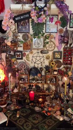 a room filled with lots of assorted items and candles on top of a table