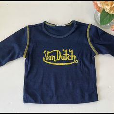 Nwot Von Dutch Kids Tee. Navy Tops With Letter Print For Spring, Fitted Blue Tops With Logo Print, Blue Letter Print T-shirt For Fall, Blue Letter Print Shirt For Fall, Blue Shirt With Letter Print For Fall, Fall Blue Shirt With Letter Print, Blue Long Sleeve Shirt With Letter Print, Blue Graphic Tee For Fall, Navy Long Sleeve Tops With Logo Print