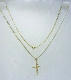 Plated gold crucifix cuban chain necklace. Perfect for a gift! Chain measure: 24¨inches Width and thickness: 2mm x 1mm Crucifix measure: 3.50cm x 2 cm Gold Cross Figaro Chain Necklace, Gold Figaro Chain Cross Necklace, Gold Cross Necklace With Figaro Chain, Gold Figaro Chain Necklace With Cross Pendant, Gold Figaro Chain Necklace With Cross Shape, Crucifix Cross Necklace With Curb Chain As Gift, Crucifix Cross Necklace With Curb Chain For Gifts, Gold Cross Necklace With Curb Chain, Gold Curb Chain Necklace With Cross Shape